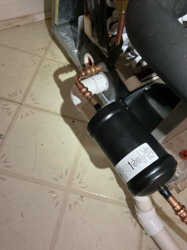 Responded to customer complaint of air conditioning system not keeping up with cooling demand. Performed diagnostic evaluation of indoor air handler and refrigerant circuit components. Inspected copper refrigerant lines, filter drier, brass fittings, and flare connections for proper operation and refrigerant flow. Examined PVC condensate drainage system and verified proper installation of insulated refrigerant lines. Assessed electronic control components and verified electrical connections to air handler unit. System evaluation completed to identify cause of inadequate cooling performance.