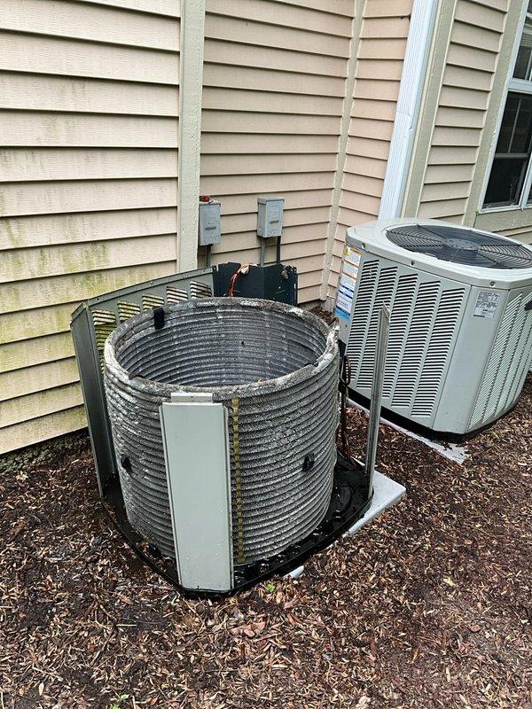 Completed comprehensive BFMA tune-up on 13+ year old residential air conditioning system during scheduled afternoon arrival window. Performed full system inspection, cleaned condenser coils which showed significant dust and dirt accumulation, replaced air filter, verified electrical connections at outdoor disconnect boxes, and tested unit operation to ensure proper cooling performance. Both outdoor condenser units were serviced and confirmed operational with all components functioning within normal parameters.