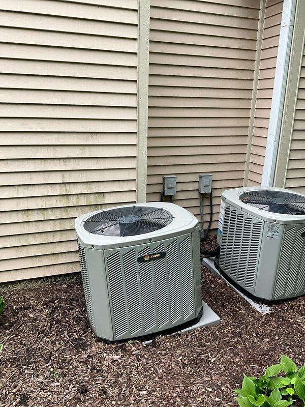 Completed comprehensive BFMA tune-up on 13+ year old residential air conditioning system during scheduled afternoon arrival window. Performed full system inspection, cleaned condenser coils which showed significant dust and dirt accumulation, replaced air filter, verified electrical connections at outdoor disconnect boxes, and tested unit operation to ensure proper cooling performance. Both outdoor condenser units were serviced and confirmed operational with all components functioning within normal parameters.