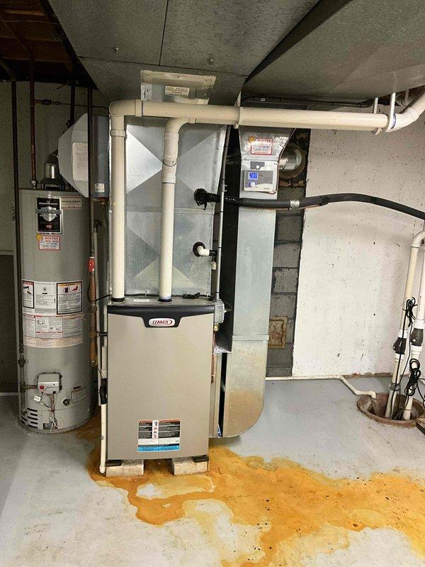 Completed full HVAC system replacement consisting of Lennox EL297UH090XV36CK high-efficiency gas furnace, EL16KC1-036-230 3-ton condenser unit, cased evaporator coil model AA1210, and P200 condensate pump. Installed new 20-amp 2-pole breaker for electrical service, ran white PVC condensate drainage lines, and connected all ductwork to existing distribution system. Coordinated with licensed plumber for domestic water heater and sump pump installation to complete basement mechanical room upgrade.