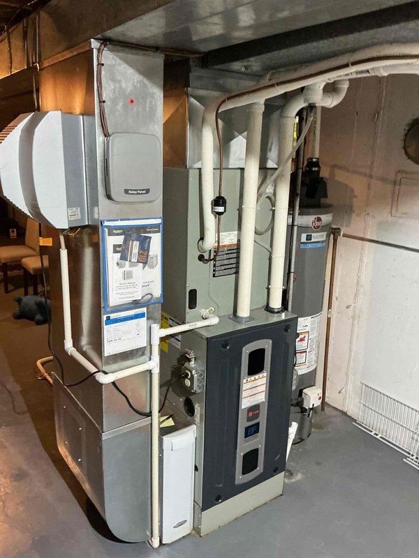 # HVAC Maintenance Report

Completed comprehensive BFMA preventive maintenance tune-up on residential forced air system. Performed visual inspection of furnace, humidifier, and associated components in basement mechanical room. All equipment found to be in good working condition with proper clearances maintained. Inspected blower motor assembly, refrigerant lines, and electrical connections within air handler unit. Copper refrigerant tubing and motor housing showed normal wear consistent with system age. Verified proper operation of all system components. PVC condensate drainage and venting inspected and confirmed clear. System left in proper operating condition with no immediate service needs identified.