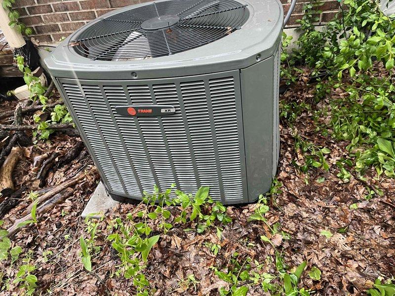 Completed comprehensive BFMA tune-up service on 10-year-old Trane outdoor condensing unit. Performed full system inspection, replaced 20x25 air filter showing moderate dust accumulation, cleared vegetation and debris from around condenser unit to ensure proper airflow, and verified all system components operating within manufacturer specifications.