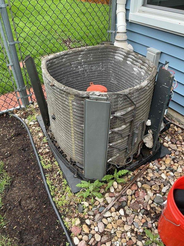 Completed comprehensive BFMA preventive maintenance tune-up on outdoor air conditioning condenser unit. Performed electrical diagnostics using digital clamp meter, recording voltage and amperage readings to verify proper system operation and compressor performance. Inspected condenser coil fins and noted significant accumulation of dirt, debris, and environmental contamination affecting heat transfer efficiency; cleaned coil surfaces to restore optimal airflow and cooling capacity. Verified all electrical connections, tested capacitor values, and confirmed unit operational parameters are within manufacturer specifications for the upcoming cooling season.