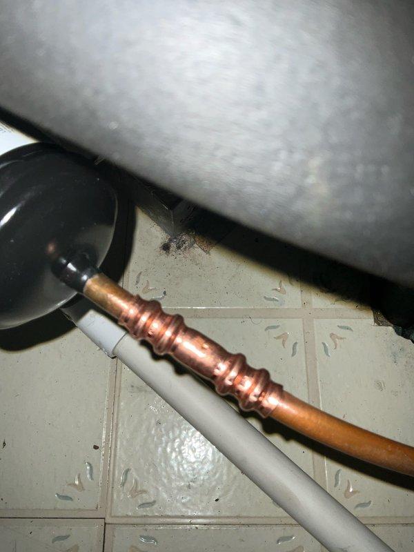 Responded to warranty call for leaking filter dryer on 410A refrigerant system. Performed system pump down, replaced defective filter dryer, conducted nitrogen pressure test to verify system integrity, evacuated system, and recharged with proper amount of 410A refrigerant to manufacturer specifications. System tested and confirmed operating properly with no leaks detected.