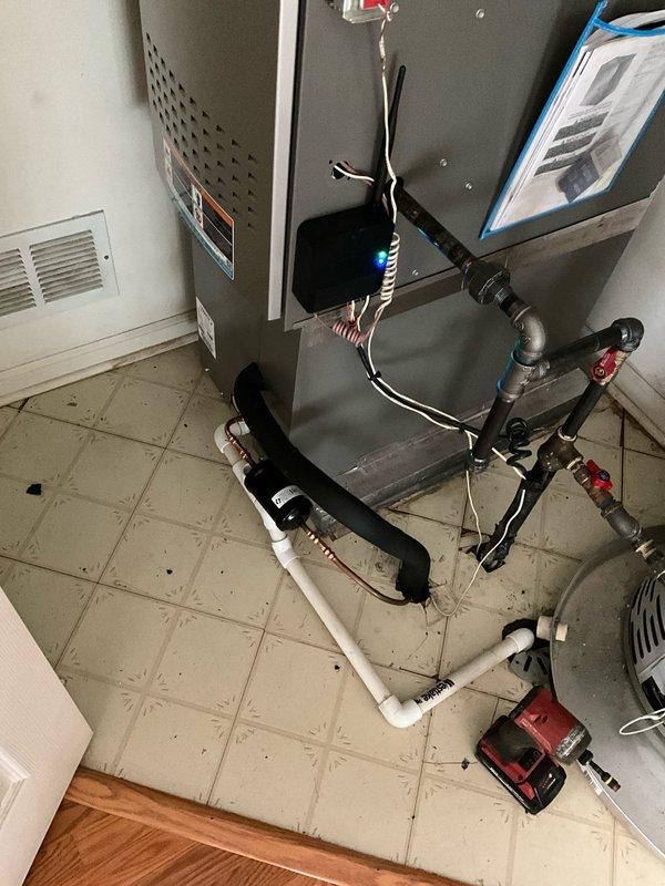 Responded to warranty call for leaking filter dryer on 410A refrigerant system. Performed system pump down, replaced defective filter dryer, conducted nitrogen pressure test to verify system integrity, evacuated system, and recharged with proper amount of 410A refrigerant to manufacturer specifications. System tested and confirmed operating properly with no leaks detected.