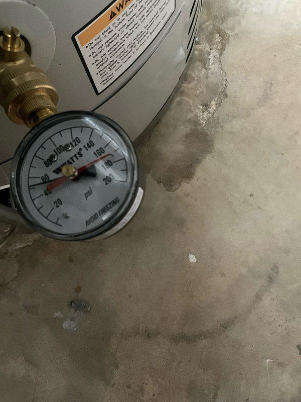 Completed complimentary plumbing inspection of residential water heater and main plumbing system. Inspected water heater unit, verified pressure gauge readings within normal operating range, and examined brass fittings and connections for proper installation and signs of wear. Assessed concrete floor area surrounding water heater for evidence of moisture intrusion or previous leaks. Inspected main water supply lines, including copper and coated steel piping, verified water meter operation, and examined all visible pipe joints and connections throughout utility area for potential leaks or deterioration. All plumbing systems found to be functioning properly with no immediate concerns identified.