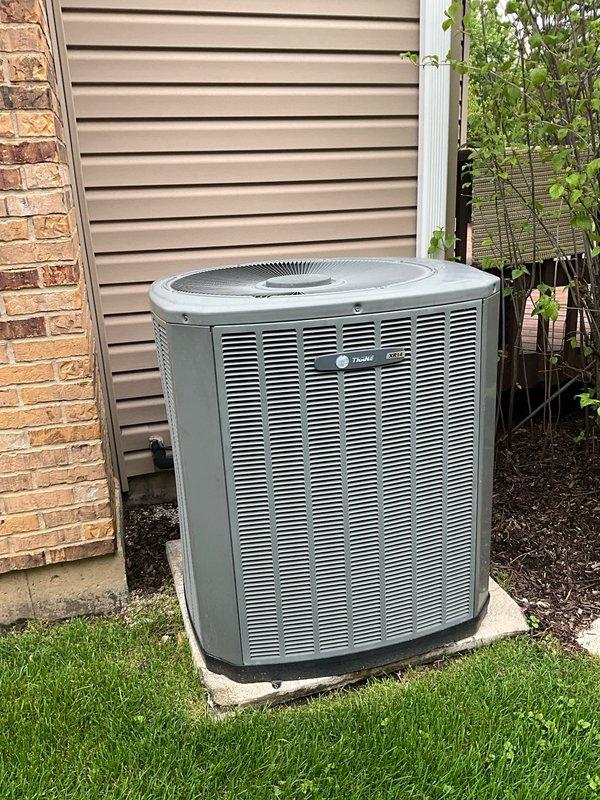 Completed comprehensive BFMA tune-up service on an 18-year-old Trane air conditioning system. Performed full system inspection of outdoor condenser unit and indoor evaporator coil assembly, verified refrigerant line connections and valve operations, and documented equipment condition through photographic records. All components found operating within normal parameters with system ready for continued seasonal use.