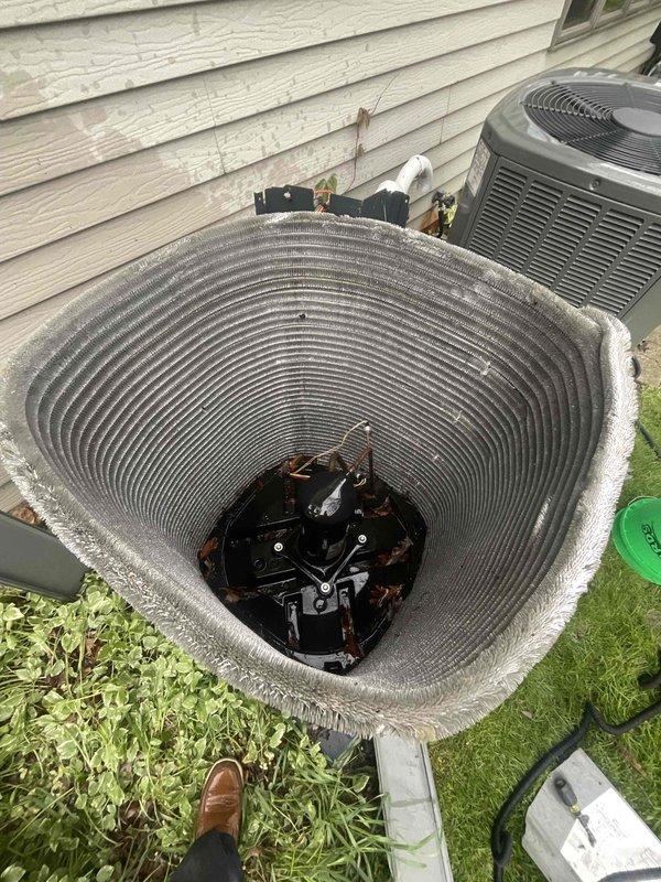 Completed BFMA tune-up service on two 6-year-old HVAC systems including air conditioning service and filter changes on both units. Performed comprehensive inspection of outdoor condenser units, removed top panels to access internal components, and evaluated condenser coils and fan motor assemblies for proper operation. Both systems were serviced according to semi-annual maintenance protocol with filters changed and equipment assessed for overall condition and performance.
