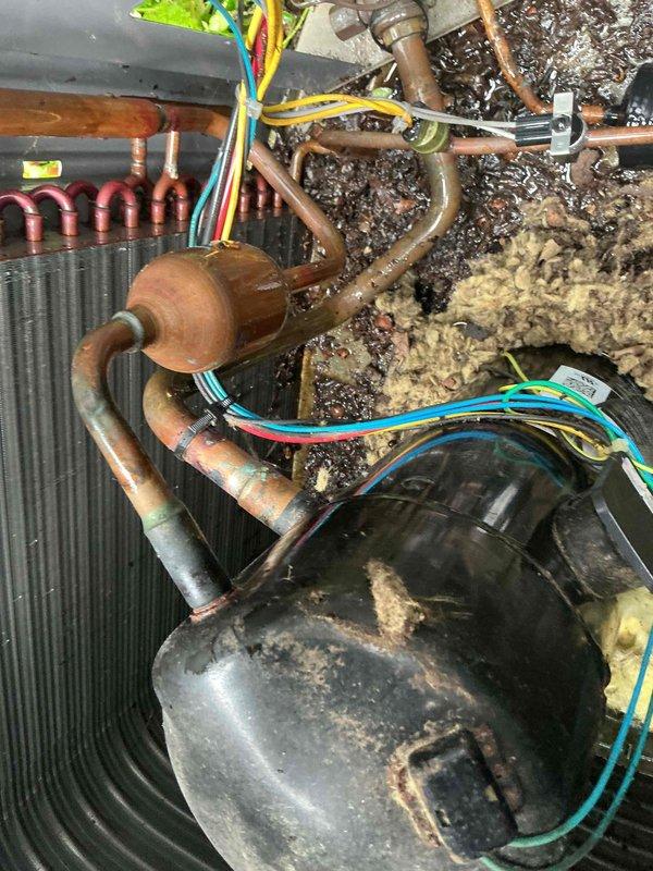 Completed comprehensive BFMA tune-up on 7-year-old Lennox residential air conditioning system. Performed full inspection of outdoor condenser unit including coil cleaning, electrical connections check, refrigerant level verification, and component testing. Inspected internal components including accumulator, copper line sets, evaporator coil, and wiring connections; all systems found operating within normal parameters with minor surface oxidation noted on copper piping consistent with equipment age.