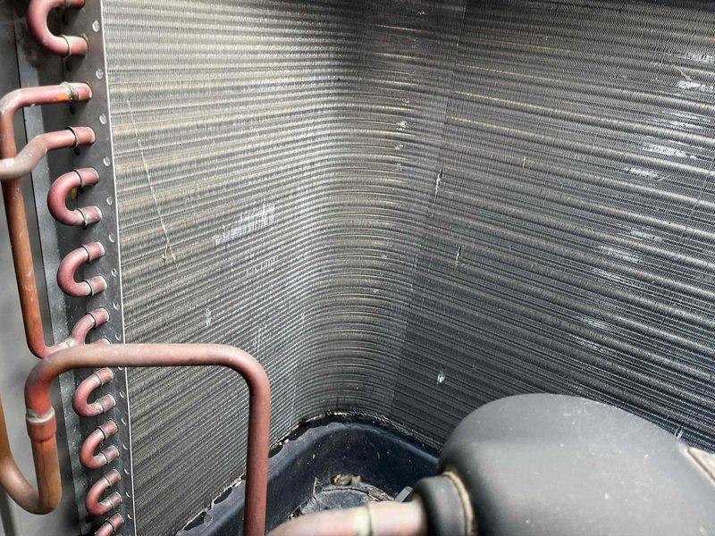 Completed comprehensive BFMA tune-up service on a 4-year-old residential air conditioning system. Performed full system inspection of outdoor condensing unit, verified proper refrigerant line connections, inspected heat exchanger coil fins for cleanliness and debris, and confirmed all components were operating within normal parameters. Unit is functioning properly with no issues identified during the maintenance visit.