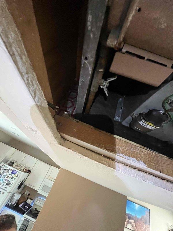 Conducted site assessment of ceiling-mounted air handler to gather complete measurements and specifications for hydronic coil installation quote. Documented existing equipment configuration, including deteriorated cylindrical component with mounting hardware, ductwork connections, and surrounding structural clearances. Captured detailed photographs of mechanical components, insulation placement, and access constraints to ensure accurate hydronic coil sizing and installation planning.