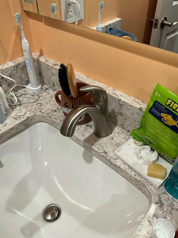 Performed comprehensive plumbing inspection and maintenance tune-up at residential property. Inspected Navien tankless water heater installation, verified proper operation with digital display reading 29°F, and examined all associated copper piping, brass fittings, valves, and insulated water lines for leaks or wear. Evaluated bathroom plumbing fixtures including sink faucet and drainage system to ensure proper function and identify any potential maintenance concerns.