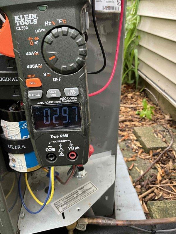 Completed comprehensive BFMA tune-up on a 2-year-old residential air conditioning system. Performed thorough inspection of outdoor condenser unit, which showed significant accumulation of dirt and debris on coil fins requiring cleaning. Measured and recorded operating amperage at 2.91A using digital clamp meter to verify proper compressor performance. Conducted full system evaluation including electrical connections, refrigerant pressures, and overall unit operation to ensure optimal efficiency and reliability for continued service.