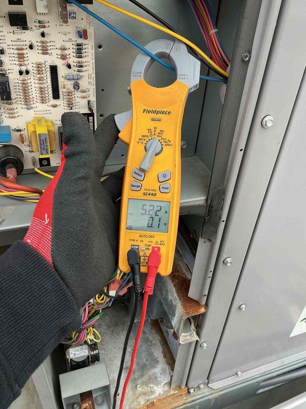 Completed comprehensive BFMA preventive maintenance tune-up on 7-year-old commercial rooftop unit. Performed electrical diagnostics using clamp meter, recording amperage readings and verifying proper voltage to compressor and system components. Inspected all electrical connections, control board functionality, and wiring integrity within the RTU cabinet. Examined compressor assembly, verified proper operation of all mechanical components, and documented system performance parameters to ensure optimal efficiency and reliability for continued service.
