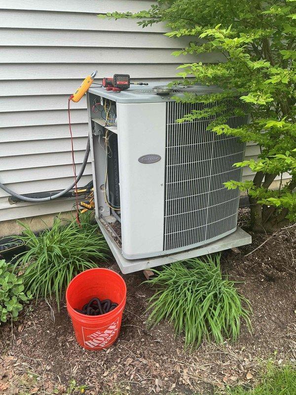 Completed comprehensive air conditioning tune-up on older Carrier condensing unit. Performed standard maintenance protocol including refrigerant charge verification using manifold gauges, electrical system inspection with access panel removed, and thorough examination of condenser coil condition. Unit operating within normal parameters upon completion of service.