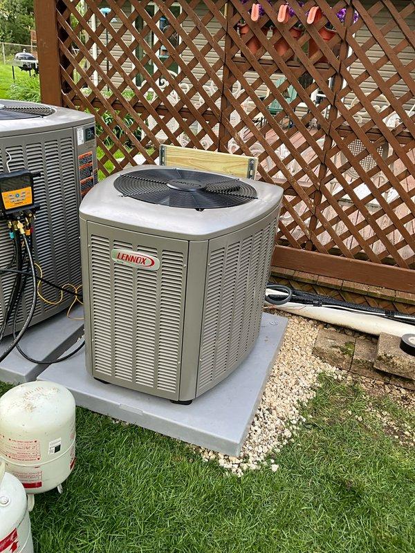 Completed full HVAC split system installation on first floor consisting of Lennox EL15KC1-030 air conditioner, SL280DF090V36B downflow furnace rated at 80% AFUE, Healthy Climate humidifier model 1410, and Ecobee smart thermostat. Relocated existing condenser unit 12 feet from original position, installing new electrical whip and refrigerant lineset to accommodate the repositioning. Installed all equipment in interior utility closet with vertical stacking configuration including furnace, humidifier, and air purification system, connected with flexible aluminum ductwork. Positioned outdoor condensing unit on concrete pad with proper clearances, completed all electrical connections, refrigerant line installation, condensate drainage, and thermostat wiring. System tested and operational upon completion.