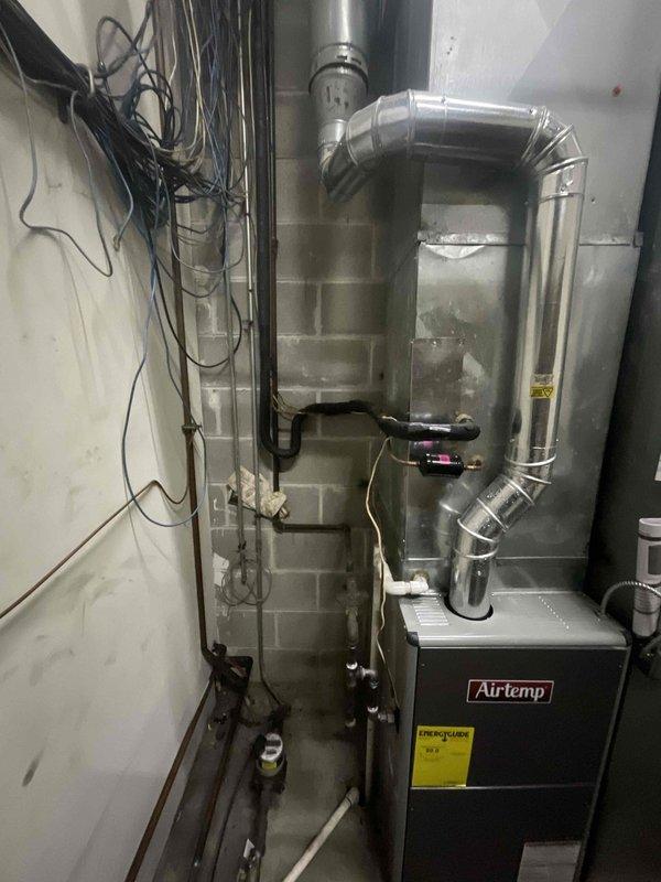 Completed comprehensive BFMA tune-up service on commercial rooftop AC unit and basement furnace system for 18-year-old equipment. Performed standard preventive maintenance procedures including inspection of AirTemp furnace, ductwork connections, refrigerant lines, condensate drainage system, and electrical components. All systems operational and functioning within normal parameters upon completion of scheduled maintenance visit.
