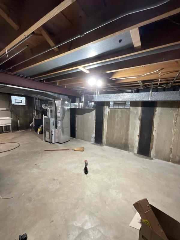 Completed installation of 30 linear feet of 8x8 square galvanized ductwork in unfinished basement area to replace previously removed duct runs. Work was performed with homeowner offsite using provided access code. New ductwork was installed between two existing runs to restore proper airflow distribution throughout the HVAC system. All metal duct connections were secured and sealed to manufacturer specifications. Drywall repair and finishing around new ductwork to be completed by others as specified in work order.