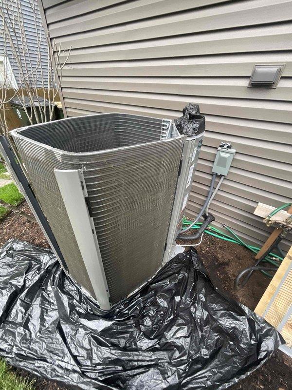 Completed comprehensive BFMA tune-up on 7-month-old residential air conditioning system. Performed standard preventive maintenance including inspection of outdoor condenser unit, verification of refrigerant line connections, assessment of heat exchanger fins and coil condition, and evaluation of overall system operation. Unit found in good working condition with minor dirt accumulation on exterior surfaces; confirmed proper installation on concrete pad with adequate clearance for airflow and servicing access.