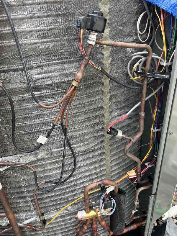 Completed comprehensive BFMA tune-up service on residential HVAC system with equipment over 2 years old, scheduled for afternoon arrival with 30-minute notice. Performed standard air conditioning maintenance protocol including inspection of evaporator coil, refrigerant lines, electrical connections, and safety controls. Documented system components including heat exchanger coil condition, copper refrigerant piping, electrical wiring harness, and associated mechanical equipment with photographic evidence for service records.