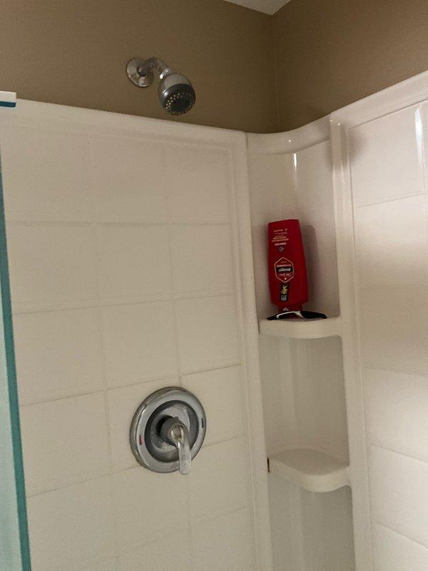 Completed comprehensive plumbing inspection and maintenance tune-up at residential property. Inspected Bradford White natural gas water heater manufactured March 2019, verified proper operation and safety label compliance, and documented unit specifications including 73.8-liter capacity. Performed visual inspection of bathroom plumbing fixtures including shower valve assembly and chrome fixtures, confirming all components functioning properly with no leaks or operational concerns identified.