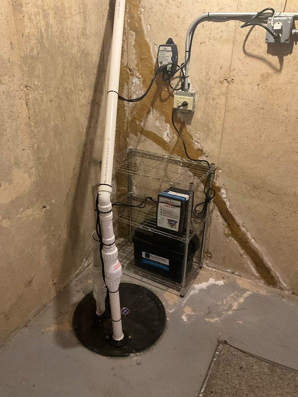 Completed comprehensive plumbing inspection as part of preventative maintenance tune-up service. Inspected and documented water heater installation with proper venting and expansion tank configuration, verified all plumbing connections and valves for proper operation. Evaluated sump pump system and battery backup unit in basement, confirmed discharge piping secured appropriately with mounting hardware, and noted existing moisture indicators on foundation walls for homeowner awareness.