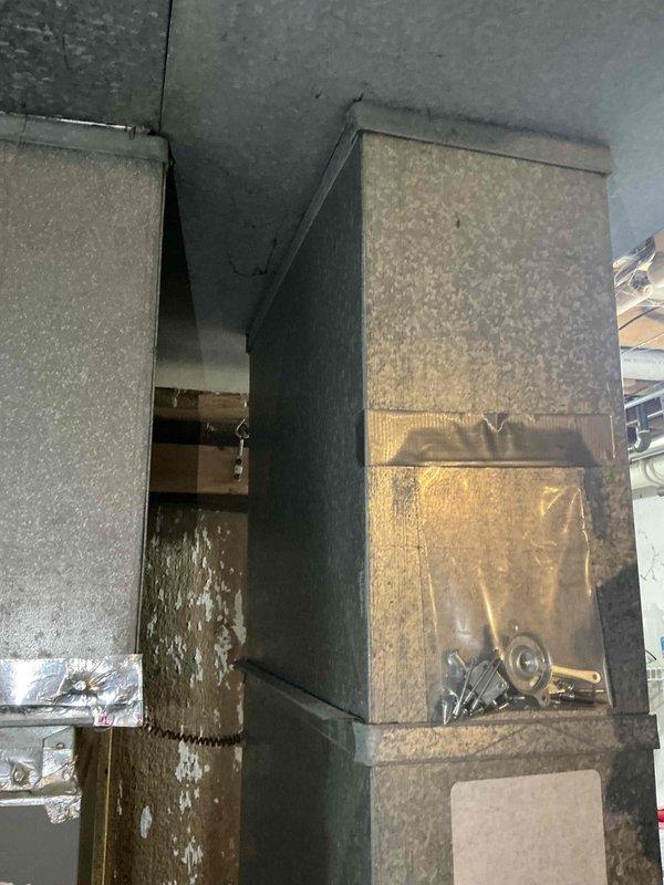 Completed sales estimate for furnace replacement on residential HVAC system. Customer currently has heat but experienced heat exchanger issues during previous service call last year and is proactively exploring replacement options before next heating season. Inspected existing air handler unit and ductwork system located in attic space, documented equipment condition and configuration including supply plenum, damper controls, and foil-wrapped ductwork connections. Photographed current system setup to assess replacement requirements and proper equipment sizing for home comfort needs.