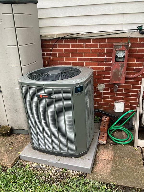 Performed comprehensive BFMA tune-up service on residential Trane air conditioning system aged 3+ years. Conducted complete system inspection of outdoor condensing unit, verified operational parameters, and replaced standard pleated air filter showing moderate dust accumulation. All components inspected and found operating within manufacturer specifications, with system ready for continued seasonal operation.