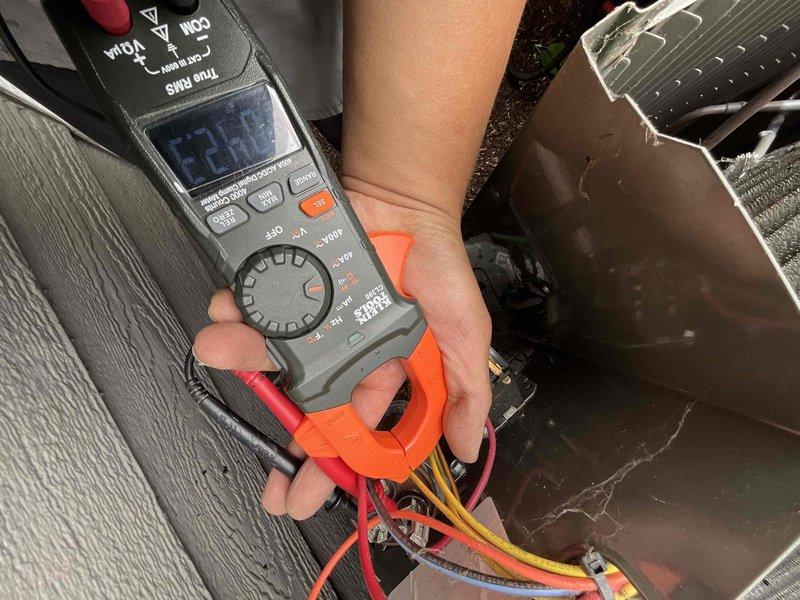Completed comprehensive BFMA tune-up on 10-month-old air conditioning system. Performed electrical diagnostics using clamp meter to verify amperage draw and system performance on compressor circuit. Inspected evaporator coil assembly, refrigerant lines, and motor components through access panel, confirming all mechanical systems operating within manufacturer specifications with no issues detected.