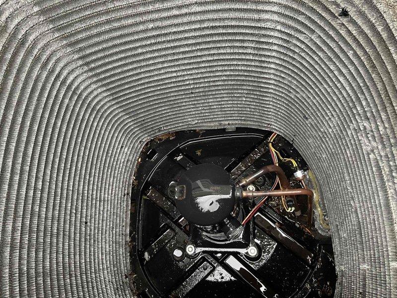 Completed comprehensive BFMA tune-up on 10-month-old air conditioning system. Performed electrical diagnostics using clamp meter to verify amperage draw and system performance on compressor circuit. Inspected evaporator coil assembly, refrigerant lines, and motor components through access panel, confirming all mechanical systems operating within manufacturer specifications with no issues detected.