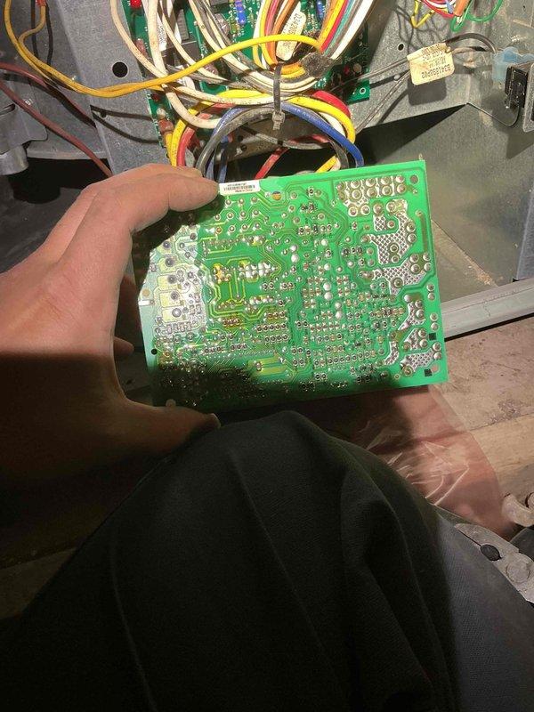Replaced faulty control board on HVAC unit. Retrieved replacement part and successfully installed new green PCB, connecting all wire harnesses including yellow, red, blue, green, white, and black wires to proper terminals within the control panel enclosure. System tested and restored to normal operation.