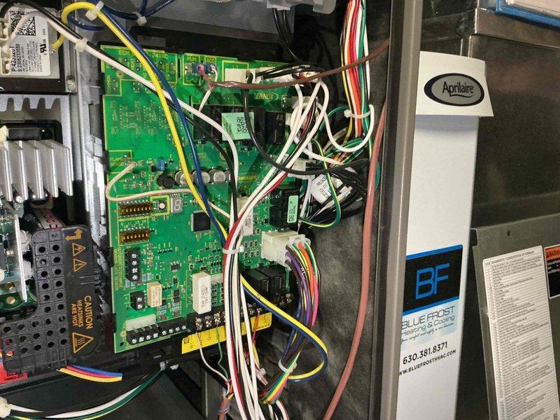 Completed comprehensive air conditioning tune-up on one-year-old system. Performed standard maintenance inspection of thermostat operation, verified proper temperature display and control settings, and inspected HVAC control board and electrical connections. All circuit boards, wiring harnesses, and system components found to be in good working condition with no issues identified.