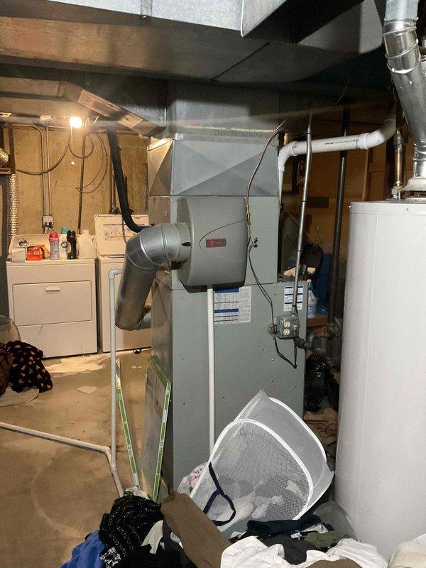 Conducted commercial HVAC system assessment in basement mechanical room. Identified failed heat exchanger and defective blower motor on existing furnace unit. Documented equipment specifications and current system configuration including ductwork layout and water heater proximity. Prepared comprehensive replacement estimate for full system installation to address critical component failures and ensure proper heating capacity for commercial application.