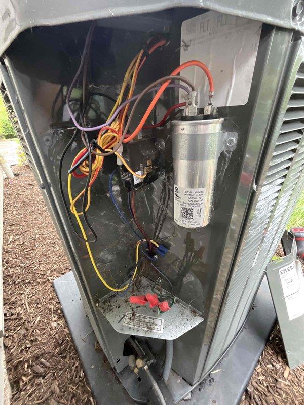 Completed comprehensive BFMA tune-up service on outdoor air conditioning condenser unit, approximately 3+ years old. Performed full system inspection including examination of electrical components, capacitor functionality, and wiring connections within the access compartment. Inspected spiral-wrapped condenser coils for debris accumulation and verified proper airflow through the unit. All electrical connections were secure, capacitor tested within normal parameters, and system operating efficiently upon completion of maintenance service.