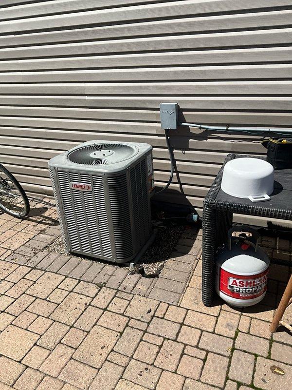 Conducted comprehensive full system HVAC estimate at residential property to assess existing equipment and determine replacement specifications. Evaluated outdoor Lennox air conditioning unit installed on brick paver patio adjacent to building with horizontal siding, noting current system configuration including associated filter/drier canister, electrical disconnect box, and refrigerant line connections. Inspected interior electrical service panel to verify circuit capacity and breaker configuration for HVAC system, documenting existing circuits for bedroom, family room, water heater, and range with various amperage ratings including 15A and 50A breakers. Assessed installation location, equipment accessibility, and electrical infrastructure to provide accurate system sizing recommendations and replacement options tailored to home's specific comfort requirements.