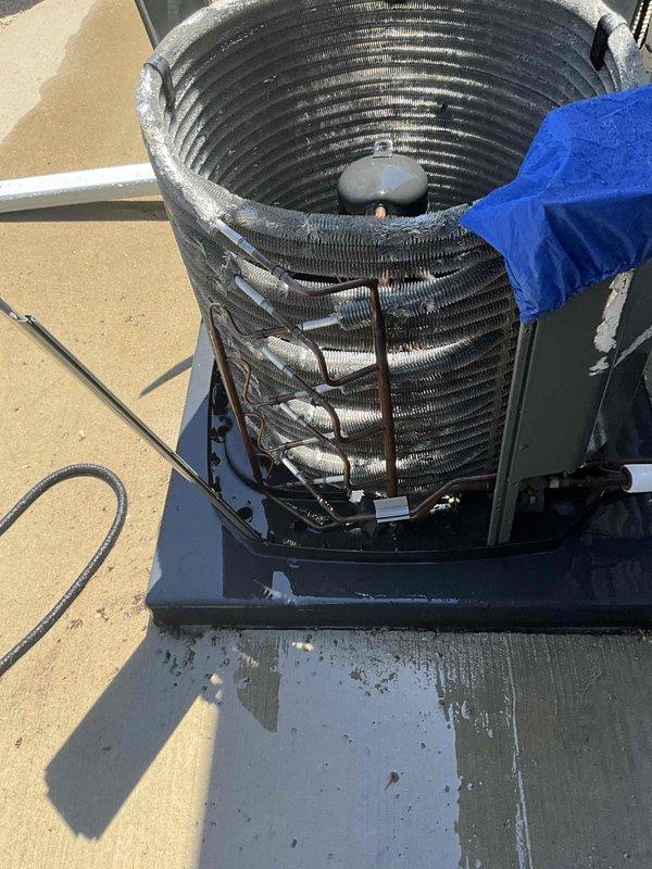Completed comprehensive BFMA tune-up service on a 2-year-old residential air conditioning system during morning hours per customer preference. Performed thorough inspection of outdoor condenser unit, including examination of cylindrical coil assembly, fan motor housing, and electrical connections. Documented equipment condition with detailed photography showing proper operation of all components and verified unit cleanliness and mounting integrity.