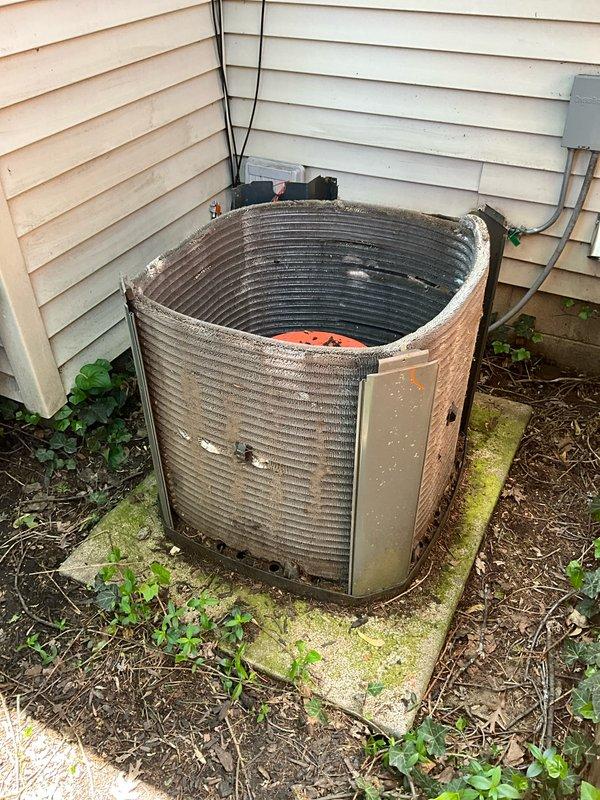 Completed comprehensive BFMA tune-up service on 10+ year old outdoor AC condenser unit. Performed standard maintenance protocol including inspection of compressor, condenser coils, refrigerant levels, electrical connections, and fan motor operation. Unit showed significant weathering and debris accumulation on exterior fins and concrete pad; cleaned condenser coils and cleared vegetation growth around base to ensure proper airflow and system efficiency.