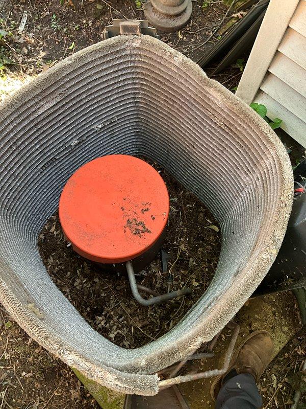 Completed comprehensive BFMA tune-up service on 10+ year old outdoor AC condenser unit. Performed standard maintenance protocol including inspection of compressor, condenser coils, refrigerant levels, electrical connections, and fan motor operation. Unit showed significant weathering and debris accumulation on exterior fins and concrete pad; cleaned condenser coils and cleared vegetation growth around base to ensure proper airflow and system efficiency.