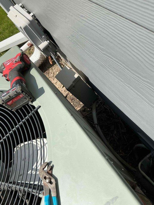 Completed comprehensive BFMA tune-up service on 14-year-old rooftop condensing unit. Removed significant accumulation of leaves, twigs, and organic debris from compressor compartment and surrounding areas that had built up over extended period without maintenance. Inspected electrical connections, verified compressor mounting, and ensured proper airflow through aluminum finned coil sections to restore optimal system performance.