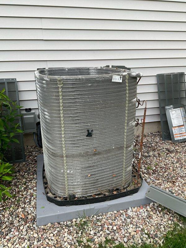 Completed comprehensive annual maintenance on residential air conditioning system. Performed visual inspection of outdoor condenser unit, noting accumulated debris and organic matter between coil fins. Cleaned condenser coils to remove dirt, leaves, and buildup affecting heat transfer efficiency. Inspected refrigerant lines, electrical connections, and mounting hardware for proper installation and secure connections. Verified unit operation and confirmed system is functioning within normal parameters for upcoming cooling season.