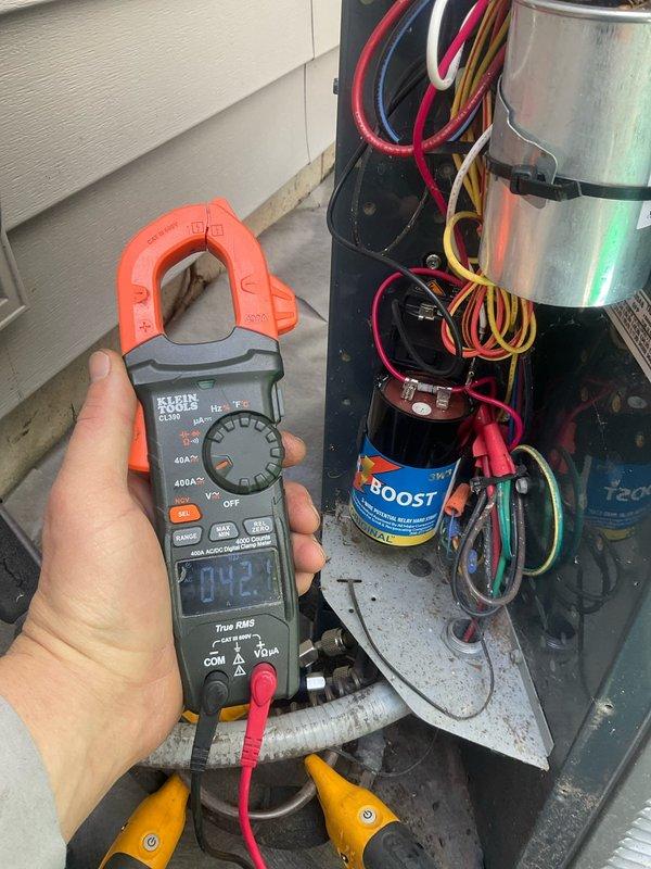 Completed comprehensive BFMA tune-up on 11+ year old outdoor air conditioning unit. Performed full system inspection, cleaned condenser coils showing weathering and debris accumulation, checked electrical components including capacitor, and verified system amperage readings using diagnostic equipment. Provided quote for soft start kit installation to enhance compressor performance and longevity on aging unit.