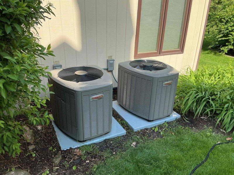 Completed comprehensive BFMA tune-up service on two Lennox air conditioning condenser units at residential property. Performed standard preventive maintenance procedures on both systems including inspection of all major components, cleaning of condenser coils which showed dirt and debris accumulation, verification of refrigerant levels, testing of electrical connections, inspection of fan assemblies and compressor operation, and evaluation of overall system performance. Both units are approximately one year old and operating within normal parameters following maintenance completion.