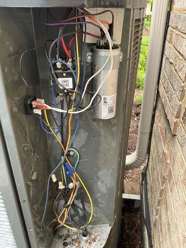 Completed comprehensive BFMA tune-up on residential air conditioning system over 5 years old. Performed full system inspection including electrical components, contactors, capacitor, and compressor unit. Removed significant accumulation of leaves and organic debris from condenser coil and interior cabinet that was restricting airflow and reducing system efficiency. Inspected all electrical connections, tested capacitor functionality, verified contactor operation, and examined copper refrigerant lines for proper condition. System operational upon completion; customer advised that air filter replacement needed but not included in membership coverage.