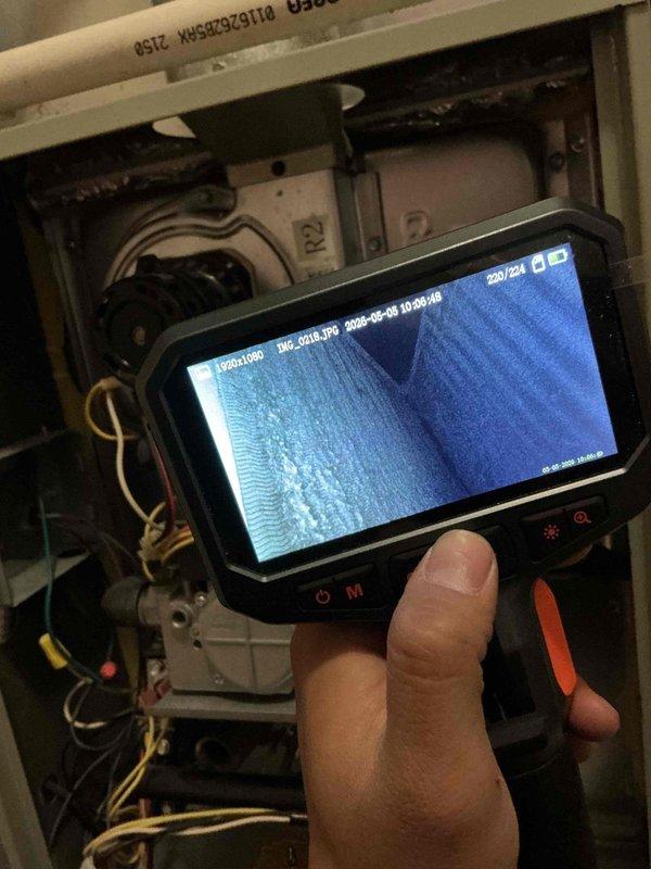 Completed comprehensive BFMA tune-up service on 18-year-old air conditioning system during scheduled morning appointment. Performed thorough inspection of all major components including blower motor assembly, electrical connections, and ductwork using digital borescope camera to examine internal components and verify proper operation. Inspected and tested TITAN PRO capacitor (TRCFD355, 440/370VAC) along with all associated wiring, contactors, and terminal connections to ensure system reliability and optimal performance for the upcoming cooling season.