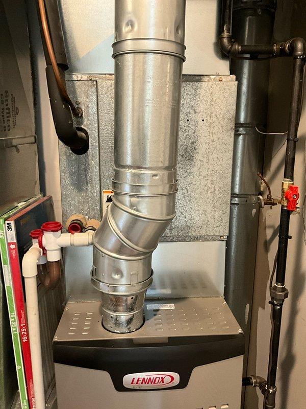 Completed comprehensive BFMA tune-up service on 26-year-old residential HVAC system including Lennox furnace and rooftop air conditioning condenser unit. Performed full system inspection, cleaned condenser coils, checked refrigerant levels, tested electrical connections, verified proper airflow through ductwork, inspected drainage system including PVC condensate lines, and confirmed all safety controls and operational parameters meet manufacturer specifications. Both indoor and outdoor units are operating efficiently with no immediate service needs identified.