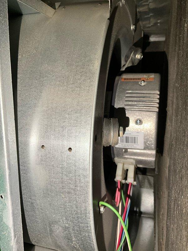 Completed comprehensive BFMA tune-up service on a 4-year-old HVAC system. Performed thorough inspection of blower assembly and motor components, noting significant dust and debris accumulation on the squirrel cage blower wheel blades. Cleaned and serviced all accessible components including the blower wheel, motor assembly, and surrounding enclosure to restore optimal airflow and system efficiency.