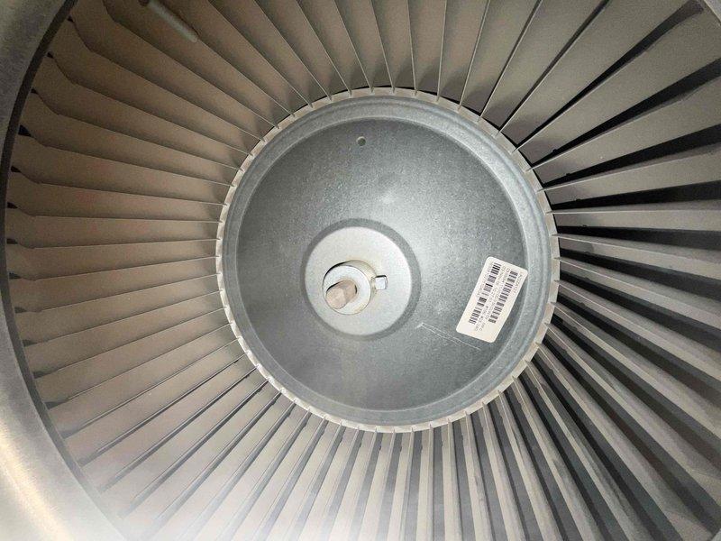 Completed comprehensive BFMA tune-up on residential air conditioning system over 3 years old. Performed full system inspection including blower assembly with clean, well-maintained fan blades and outdoor condenser unit with ribbed metal exterior housing. Verified proper operation of all components, inspected copper refrigerant lines, checked coil conditions, and confirmed system readiness for optimal cooling performance.