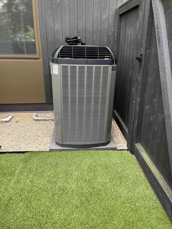 Completed comprehensive BFMA tune-up service on two air conditioning systems, both over 5 years old. Performed full system inspection including filter evaluation, condenser unit examination, and operational testing. Inspected and documented clean pleated air filter in good condition within black metal housing, verified proper installation with directional markings. Conducted exterior condenser unit assessment, confirmed unit positioned properly on concrete pad with adequate clearance, inspected louvered panels and protective top grille for damage or debris. Both systems operating within normal parameters with no immediate repairs required at time of service.
