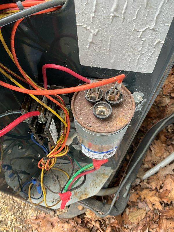 Completed BFMA preventative maintenance tune-up on outdoor air conditioning system. Performed comprehensive inspection of condenser unit, electrical components, and capacitor, noting visible corrosion on capacitor housing and motor mount assembly consistent with outdoor exposure. Discussed customer concern regarding loose flue cap on roof requiring attention.