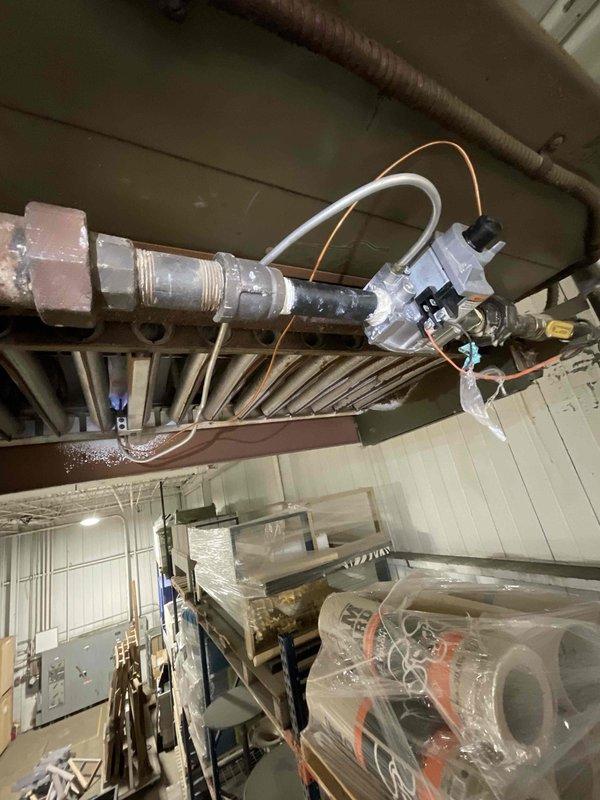 Responded to commercial service call for hanging unit #3 requiring gas valve and thermocouple replacement. Accessed unit mounted to overhead structure in warehouse facility. Removed failed gas valve assembly and defective thermocouple from unit. Installed new gas valve with proper pipe thread connections and new thermocouple with copper sensing lead. Verified proper positioning of thermocouple in pilot assembly for optimal flame detection. Tested gas valve operation through multiple heating cycles to confirm reliable pilot ignition and main burner operation. Unit restored to full operational status with all safety controls functioning as designed.